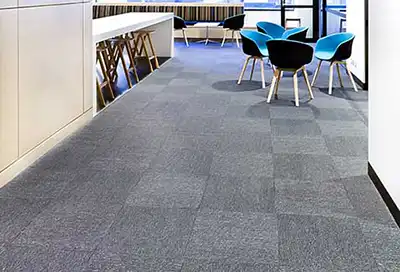 Carpet Tile in office building for blog Top 8 Commercial Flooring Types by Omega Contracting & Consulting