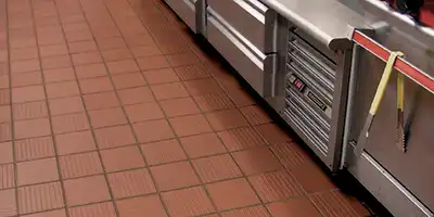 Quarry Tile in commercial restaurant kitchen for blog Top 8 Commercial Flooring Types by Omega Contracting & Consulting