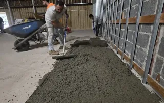 Concrete floor repair and leveling work during construction phase of Baltimore retail renovation project