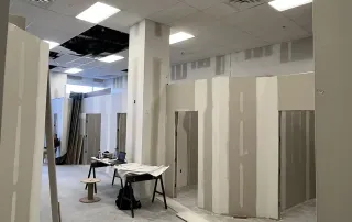 Framing and drywall installation during Palm Beach Tan retail construction remodel by Omega Contracting & Consulting
