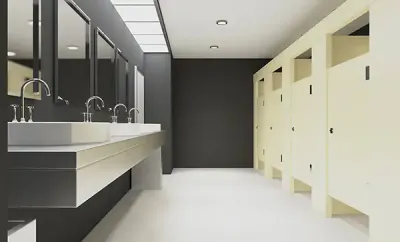 Modern commercial restroom makeover with touchless fixtures, white bowl sinks, and light partitions.